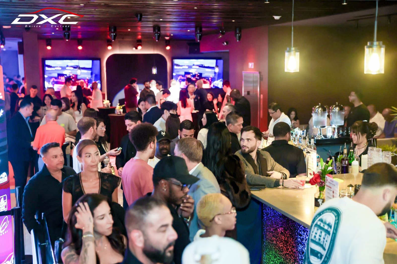 Guests mingling at the bar at DXC Launch Night