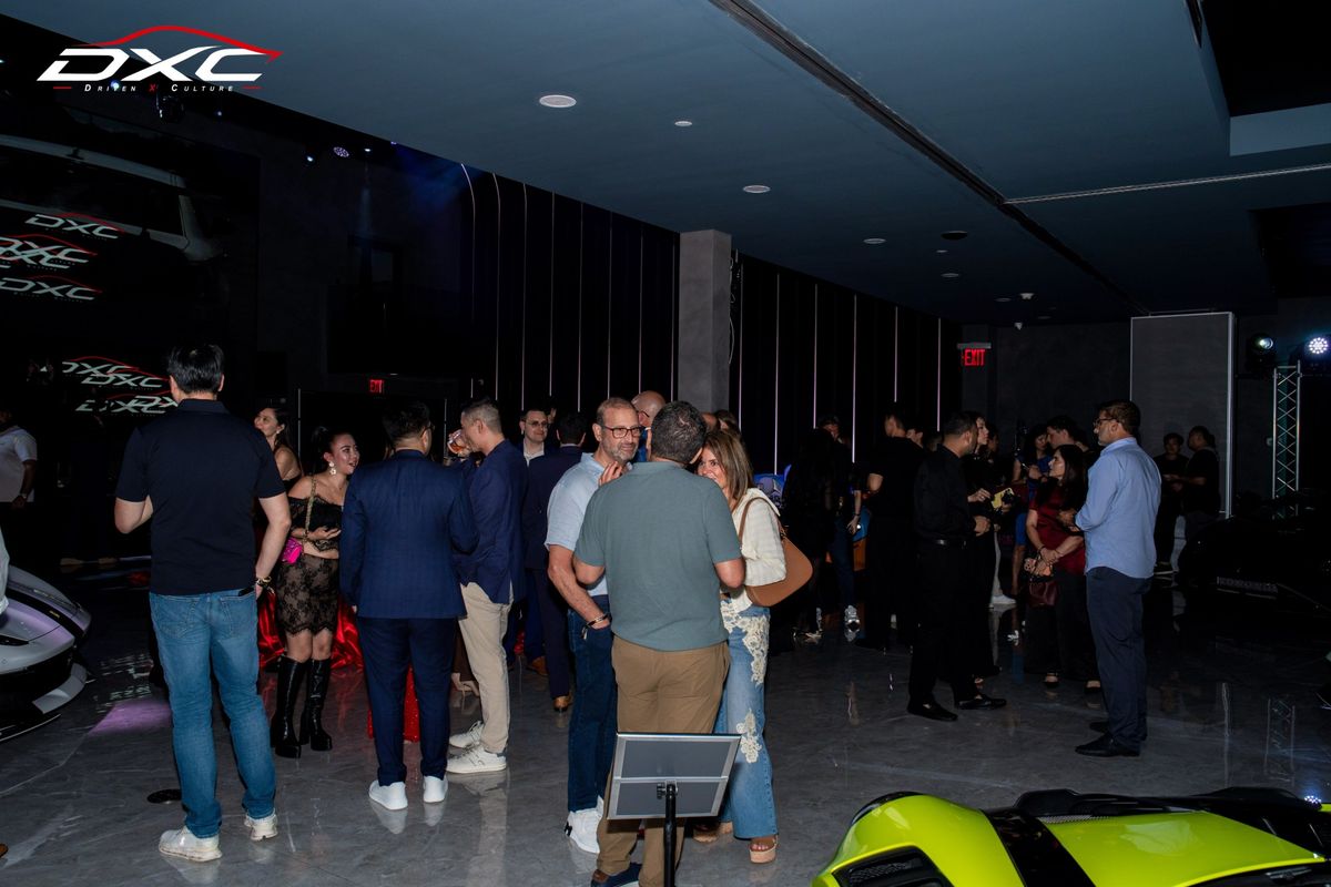Guests talking in the DXC Launch Night showroom